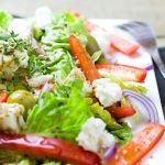 Colorful Greek salad with fresh vegetables and feta cheese.